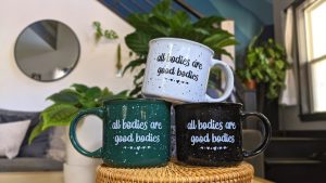 Three mugs that say all bodies are good bodies